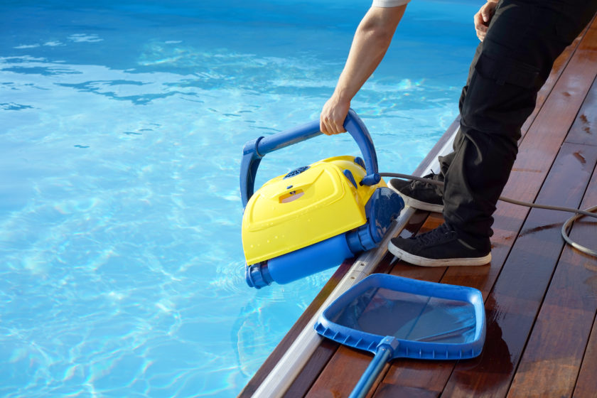 Man Holding Pool Cleaner
