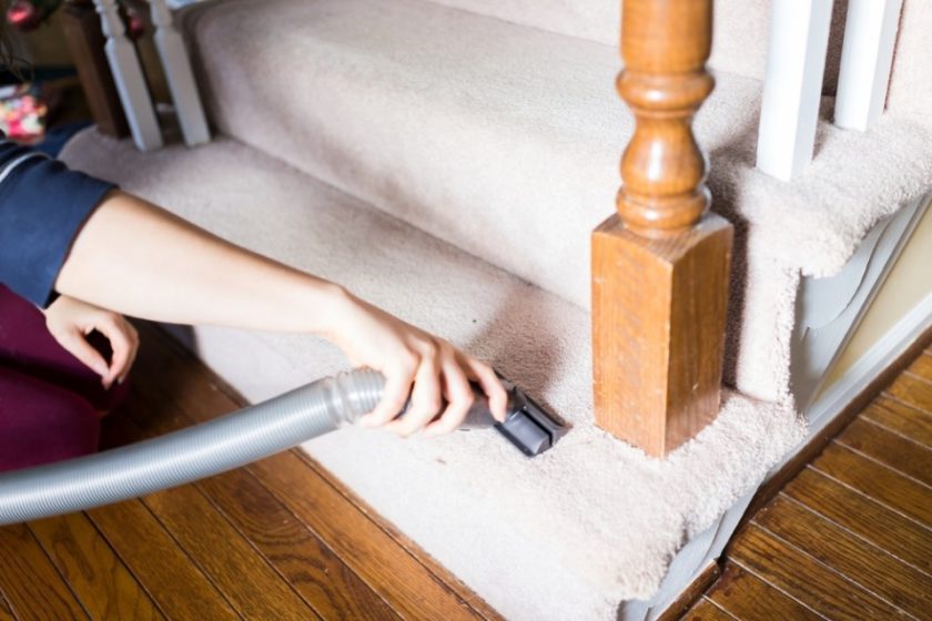 Woman Vacuuming Stairs