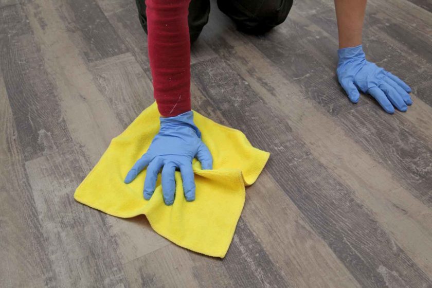 Man Hand on Floor with Laminating Sheet